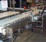 Industrial pick and place conveyor system used for automated product handling and manufacturing line efficiency.